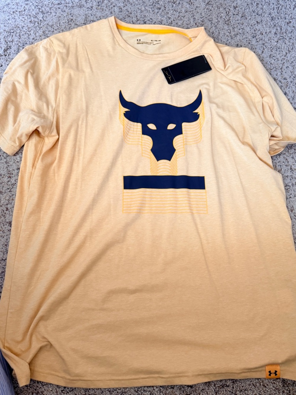 Under Armour Men’s Pale Yellow Graphic Short Sleeve Tee with The Rock’s Logo